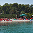 Pebble beach on the west side of the island; bay Zdrilca with “Tri grede” restaurant